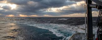 Sunrise over the back of NOAA Ship Okeanos Explorer at the end of the Gulf of Mexico 2017 expedition Sunrise over the back of NOAA Ship Okeanos Explorer at the end of the Gulf of Mexico 2017 expedition